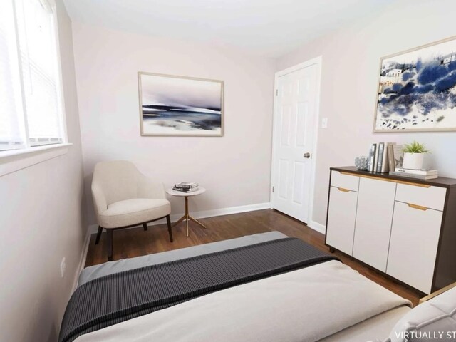 7056 S Honore St, Chicago, IL 60636 - bedroom with dark wood-style flooring and baseboards