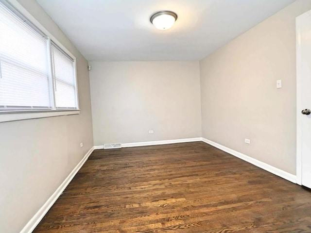 7056 S Honore St, Chicago, IL 60636 - empty room with wood finished floors and baseboards