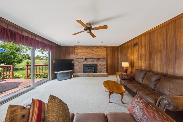 13040 W Tanglewood Cir, Palos Park, IL 60464 - carpeted living room with wood walls, a ceiling fan, and a brick fireplace