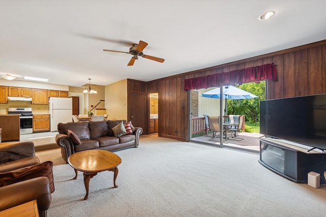 13040 W Tanglewood Cir, Palos Park, IL 60464 - living area featuring light colored carpet, a chandelier, wooden walls, and a ceiling fan