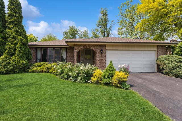 13040 W Tanglewood Cir, Palos Park, IL 60464 - ranch-style house with brick siding, asphalt driveway, a front lawn, and a garage
