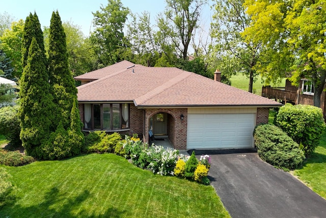 13040 W Tanglewood Cir, Palos Park, IL 60464 - view of front of home with brick siding, an attached garage, a front lawn, asphalt driveway, and a shingled roof