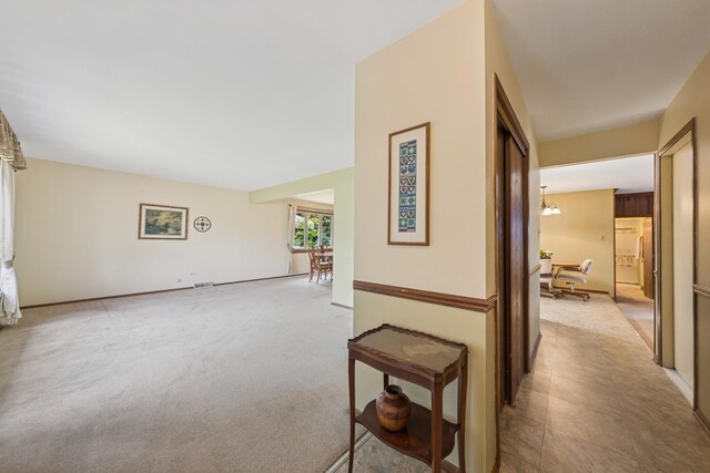 13040 W Tanglewood Cir, Palos Park, IL 60464 - hallway with a chandelier