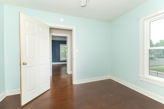 602 N Lee St, Bloomington, IL 61701 - empty room featuring dark wood-type flooring and a smoke detector