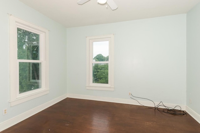 602 N Lee St, Bloomington, IL 61701 - empty room with dark wood-style flooring and ceiling fan