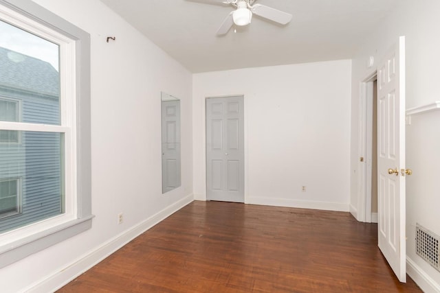 602 N Lee St, Bloomington, IL 61701 - unfurnished bedroom with wood finished floors and a ceiling fan