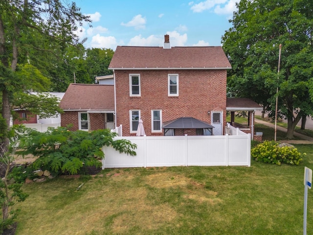 602 N Lee St, Bloomington, IL 61701 - rear view of house featuring a chimney, brick siding, a gazebo, and a shingled roof
