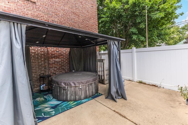 602 N Lee St, Bloomington, IL 61701 - view of patio featuring a gazebo and a hot tub