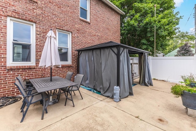 602 N Lee St, Bloomington, IL 61701 - view of patio featuring a gazebo and outdoor dining space