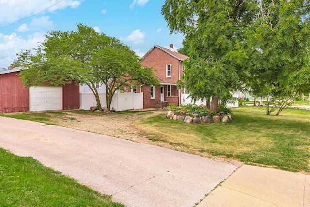 602 N Lee St, Bloomington, IL 61701 - view of property hidden behind natural elements featuring driveway, a chimney, and brick siding