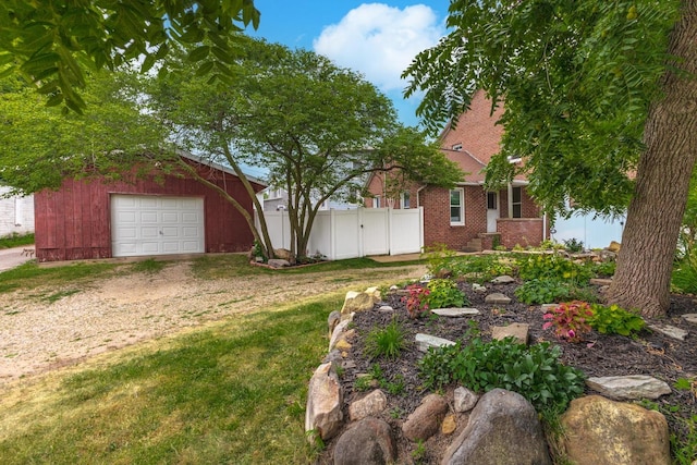 602 N Lee St, Bloomington, IL 61701 - view of yard with driveway, an outbuilding, and a garage