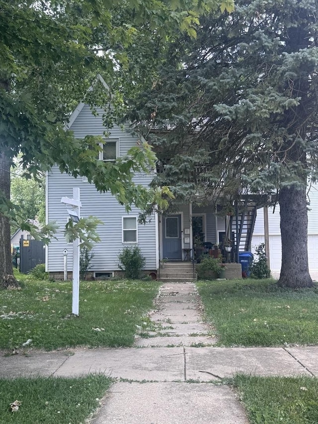 303 Fisk Ave, Dekalb, IL 60115 - obstructed view of property with a porch and a front lawn