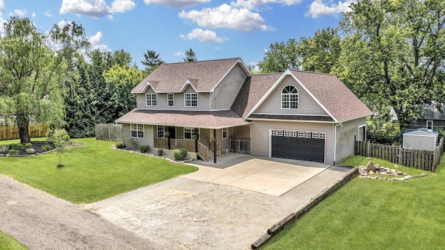 402 Lincoln St, Seatonville, IL 61359 - view of front of home featuring covered porch, driveway, a shingled roof, and a garage