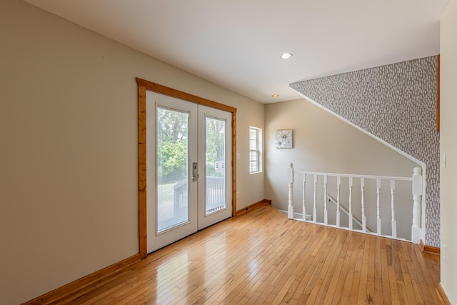 402 Lincoln St, Seatonville, IL 61359 - doorway with french doors, light wood finished floors, and recessed lighting