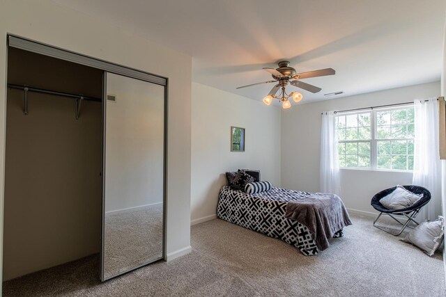 402 Lincoln St, Seatonville, IL 61359 - bedroom with carpet, a closet, and ceiling fan