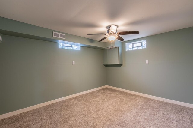 402 Lincoln St, Seatonville, IL 61359 - below grade area with carpet floors and a ceiling fan