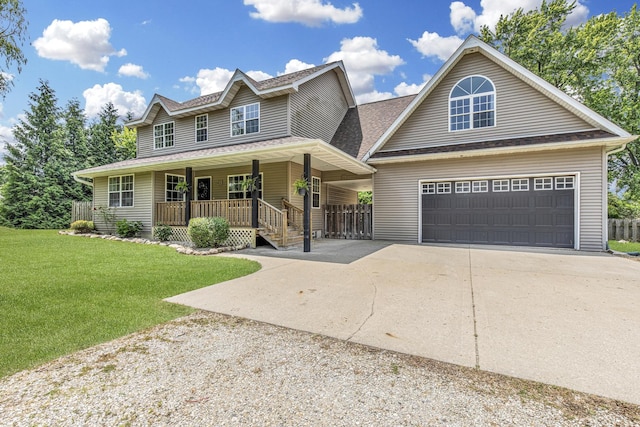 402 Lincoln St, Seatonville, IL 61359 - view of front of property featuring covered porch, concrete driveway, a front lawn, a garage, and a shingled roof