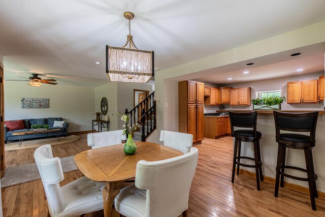 402 Lincoln St, Seatonville, IL 61359 - dining space featuring stairs, light wood finished floors, a chandelier, ceiling fan, and recessed lighting