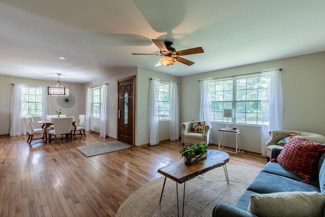 402 Lincoln St, Seatonville, IL 61359 - living room featuring light wood finished floors and a ceiling fan
