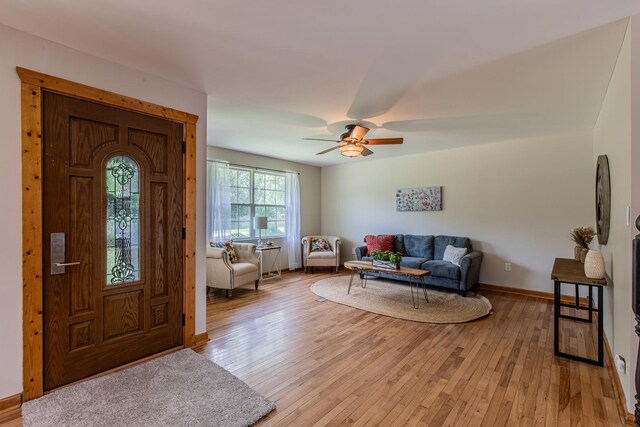 402 Lincoln St, Seatonville, IL 61359 - foyer with light wood-style floors and ceiling fan