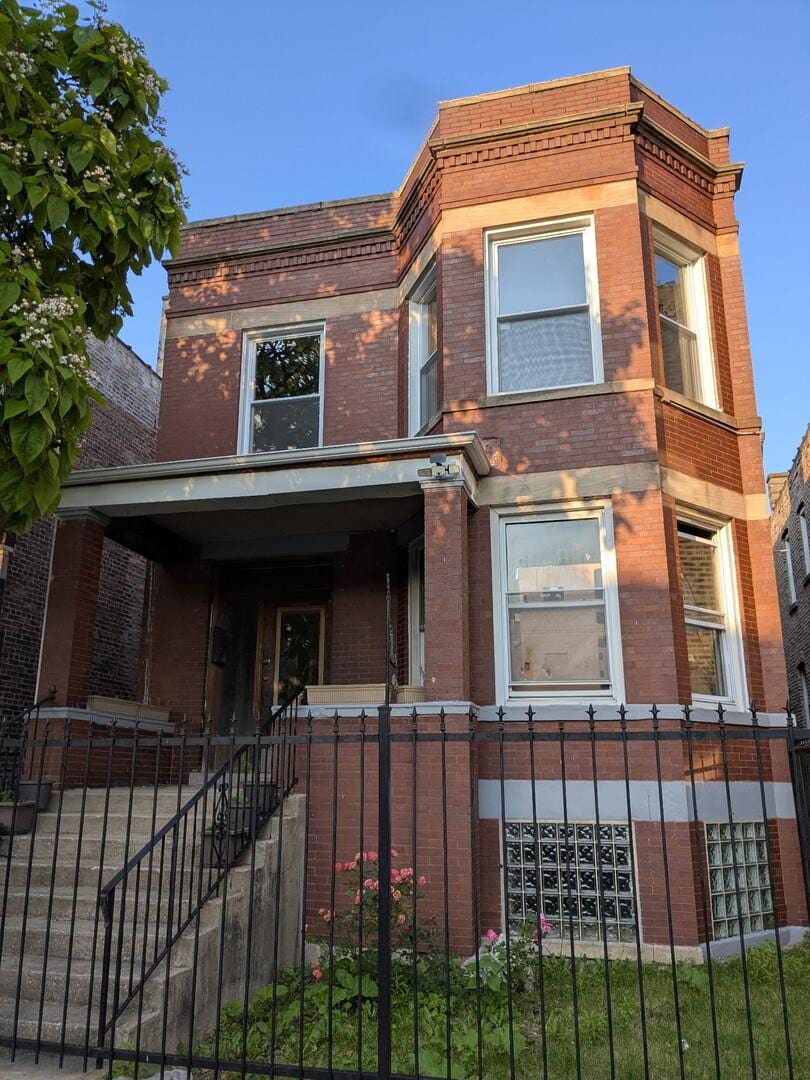5527 S Winchester Ave, Chicago, IL 60636 - view of front facade with brick siding and a porch