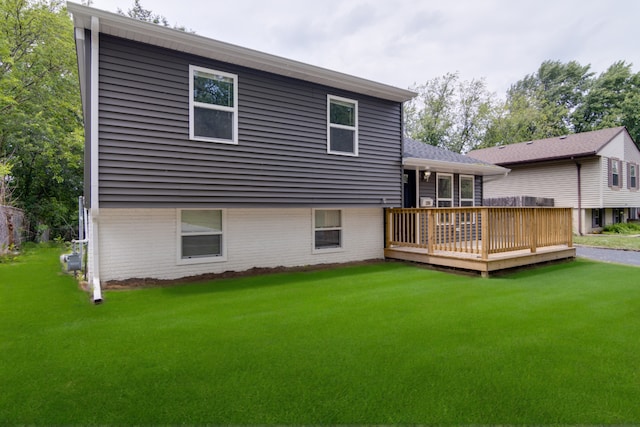 22156 Peach Tree Ave, Sauk Village, IL 60411 - rear view of house with a lawn, a wooden deck, and brick siding