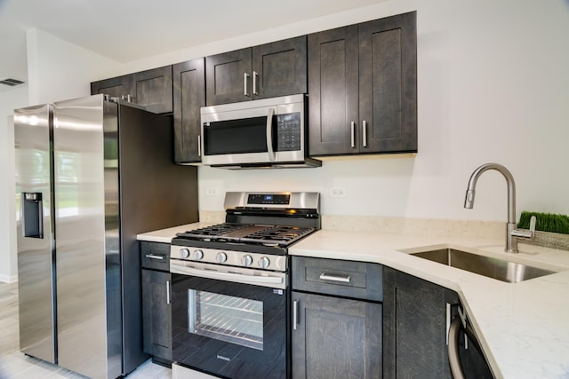 22156 Peach Tree Ave, Sauk Village, IL 60411 - kitchen with appliances with stainless steel finishes and light stone counters