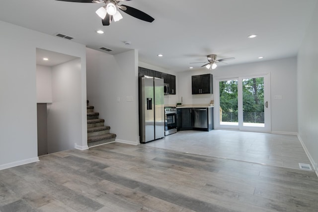 22156 Peach Tree Ave, Sauk Village, IL 60411 - unfurnished living room featuring a ceiling fan, light wood-type flooring, stairs, and recessed lighting