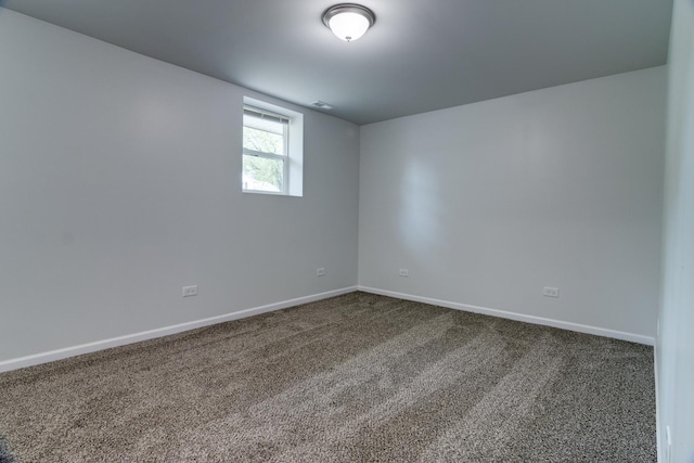 22156 Peach Tree Ave, Sauk Village, IL 60411 - spare room featuring baseboards and dark carpet