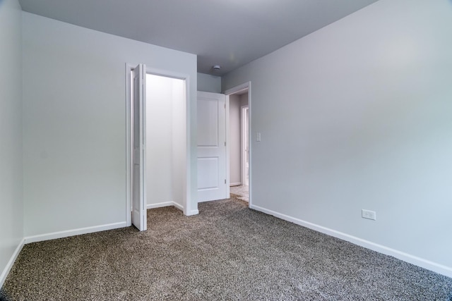 22156 Peach Tree Ave, Sauk Village, IL 60411 - unfurnished bedroom with carpet and baseboards
