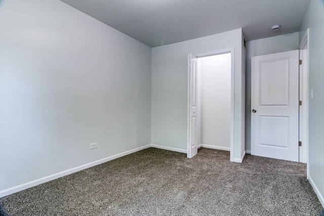 22156 Peach Tree Ave, Sauk Village, IL 60411 - unfurnished bedroom with carpet floors and baseboards