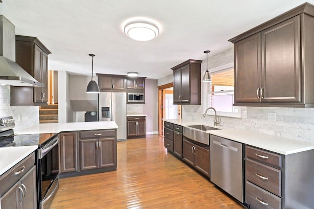 15807 W 139th St, Homer Glen, IL 60491 - kitchen featuring appliances with stainless steel finishes, wall chimney range hood, tasteful backsplash, and dark brown cabinetry