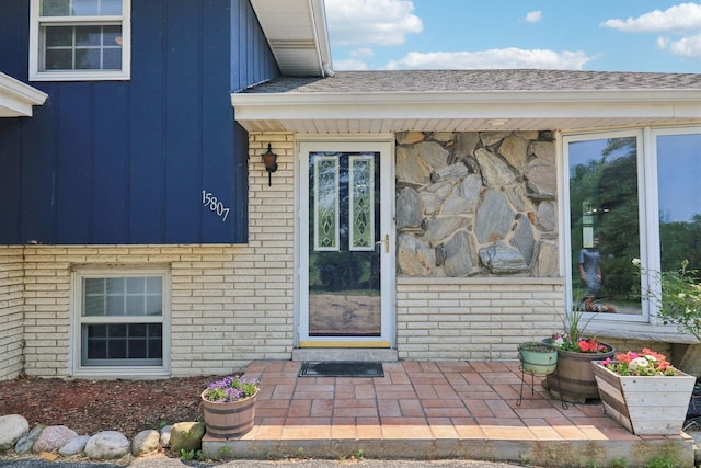 15807 W 139th St, Homer Glen, IL 60491 - view of exterior entry featuring brick siding and board and batten siding