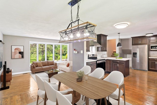 15807 W 139th St, Homer Glen, IL 60491 - dining area with light wood-style flooring and baseboards