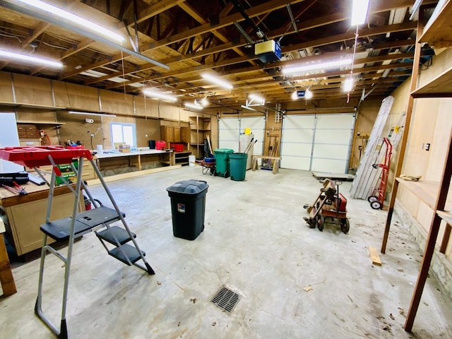 157 Prairie St, Ottawa, IL 61350 - garage featuring a garage door opener and a workshop area