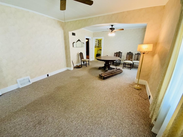 157 Prairie St, Ottawa, IL 61350 - living area featuring a ceiling fan, carpet flooring, ornamental molding, baseboards, and arched walkways