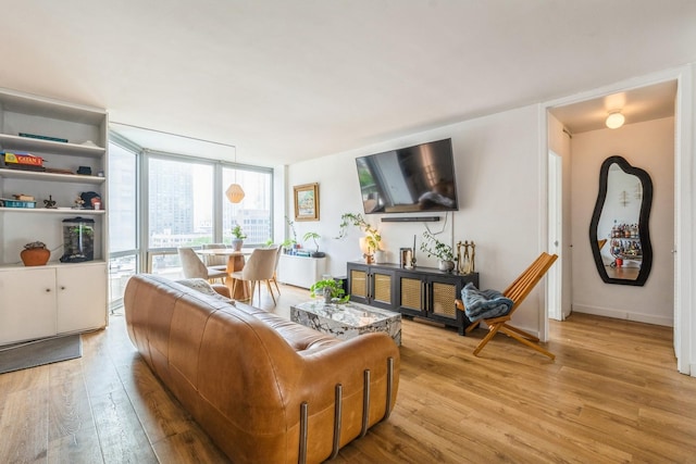 21 W Goethe St Unit 8K, Chicago, IL 60610 - living area featuring light wood-style floors and baseboards