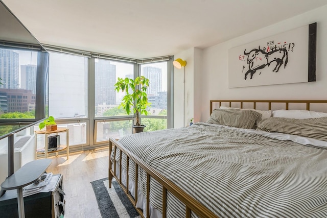 21 W Goethe St Unit 8K, Chicago, IL 60610 - bedroom featuring wood finished floors and multiple windows