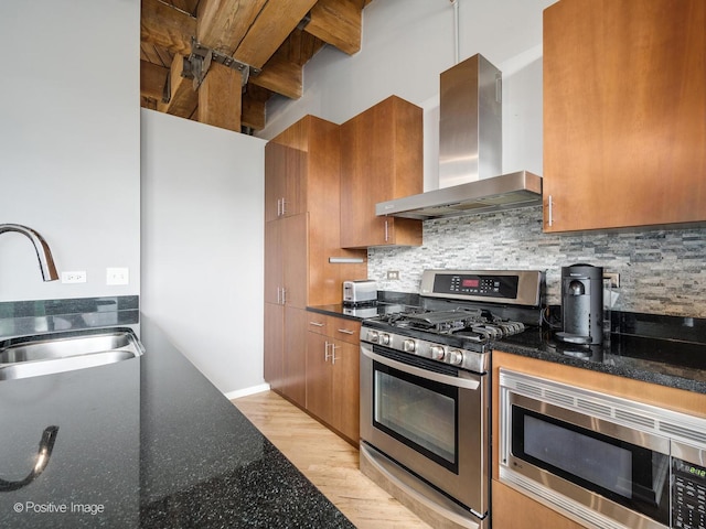 1040 W Adams St Unit 238, Chicago, IL 60607 - kitchen with wall chimney exhaust hood, appliances with stainless steel finishes, brown cabinetry, and backsplash