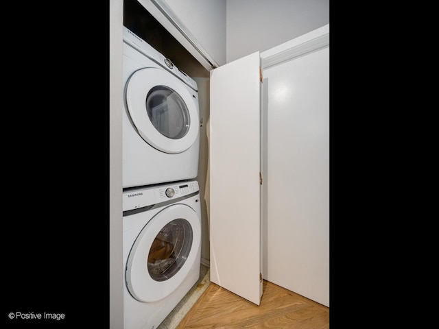 1040 W Adams St Unit 238, Chicago, IL 60607 - washroom featuring stacked washing machine and dryer