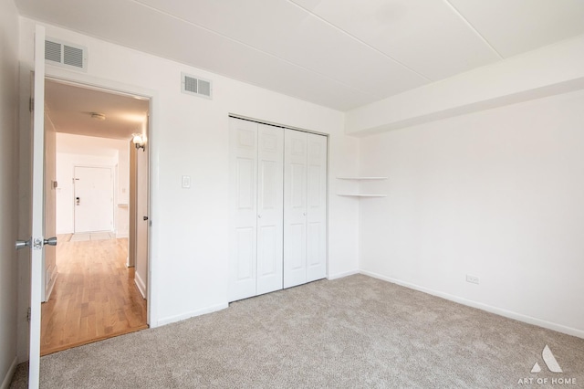 9146 W 140th St Unit 2Sw, Orland Park, IL 60462 - unfurnished bedroom featuring carpet flooring, baseboards, and a closet