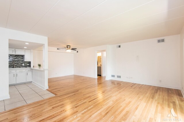 9146 W 140th St Unit 2Sw, Orland Park, IL 60462 - empty room with light wood-type flooring, ceiling fan, and baseboards