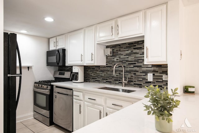 9146 W 140th St Unit 2Sw, Orland Park, IL 60462 - kitchen featuring black appliances, a sink, light countertops, backsplash, and recessed lighting