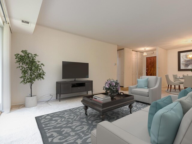 500 W Huntington Commons Rd Unit 150, Mount Prospect, IL 60056 - carpeted living area featuring a chandelier
