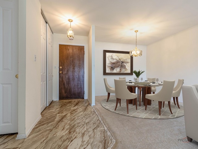 500 W Huntington Commons Rd Unit 150, Mount Prospect, IL 60056 - dining space with a chandelier and marble finish flooring