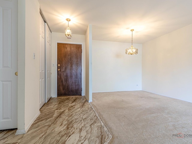 500 W Huntington Commons Rd Unit 150, Mount Prospect, IL 60056 - foyer with a chandelier and light colored carpet