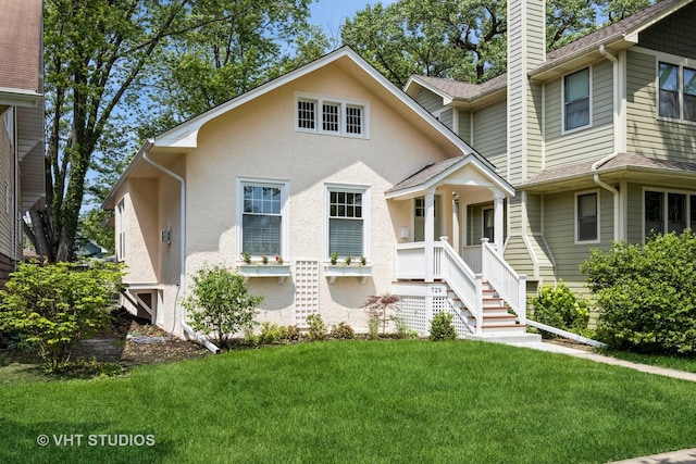 729 N Cuyler Ave, Oak Park, IL 60302 - view of front of property featuring a chimney, a front lawn, and stucco siding