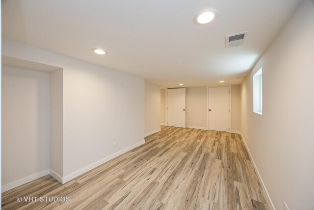 729 N Cuyler Ave, Oak Park, IL 60302 - unfurnished bedroom featuring light wood-type flooring and recessed lighting