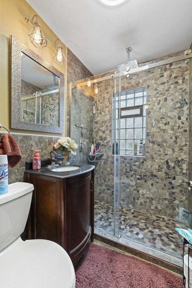 5520 S Kildare Ave, Chicago, IL 60629 - bathroom featuring vanity, a shower stall, and tile walls