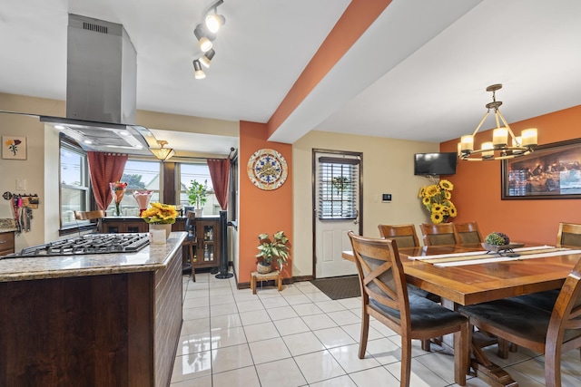 5520 S Kildare Ave, Chicago, IL 60629 - dining area with a chandelier, light tile patterned floors, and track lighting